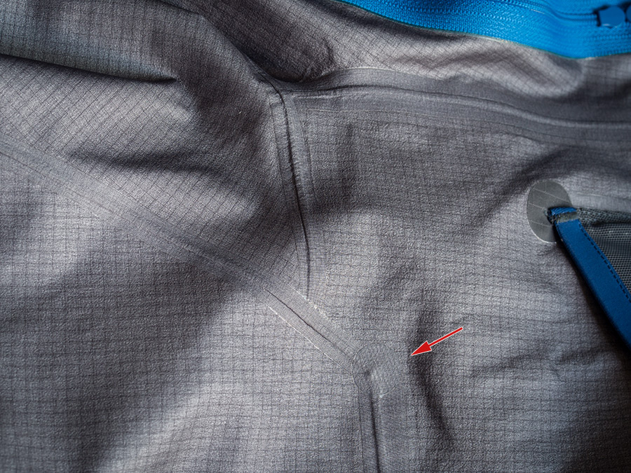 Photo of the inside of the Beta SV showing the gray square grid backing and a series of internal seams with seam tape.