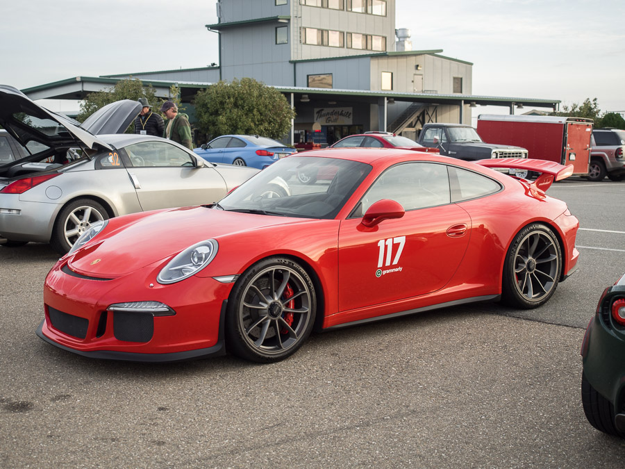 Red Porsche 911 Turbo, front three quarter view.